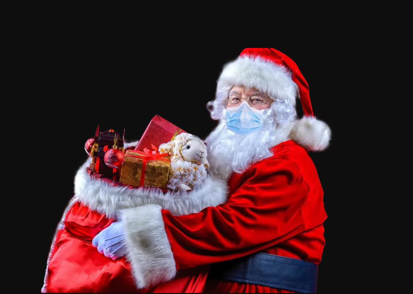 Foto do Papai Noel com máscara cirúrgica e saco de presentes